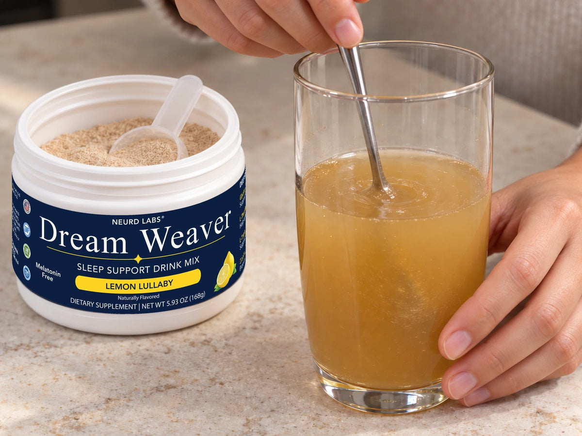 Dream Weaver powder being stirred into a cloudy amber drink.